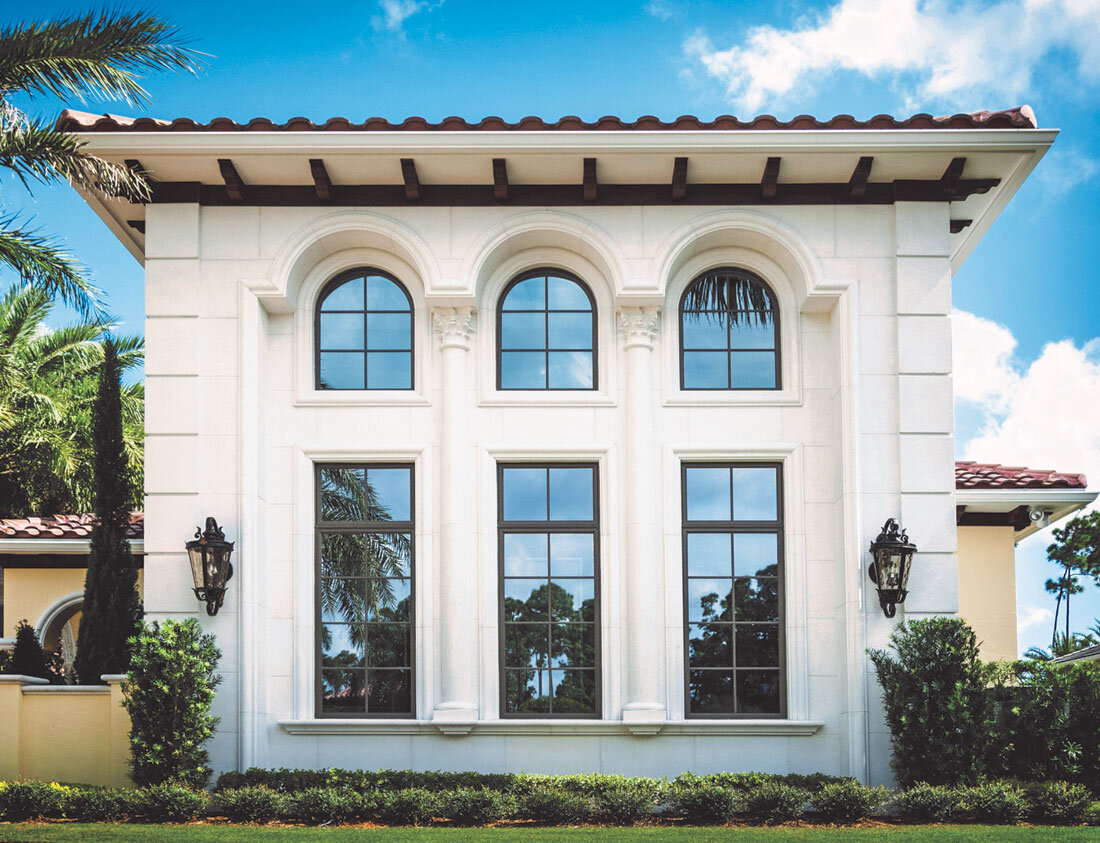 cast stone window treatment on grand window luxury home